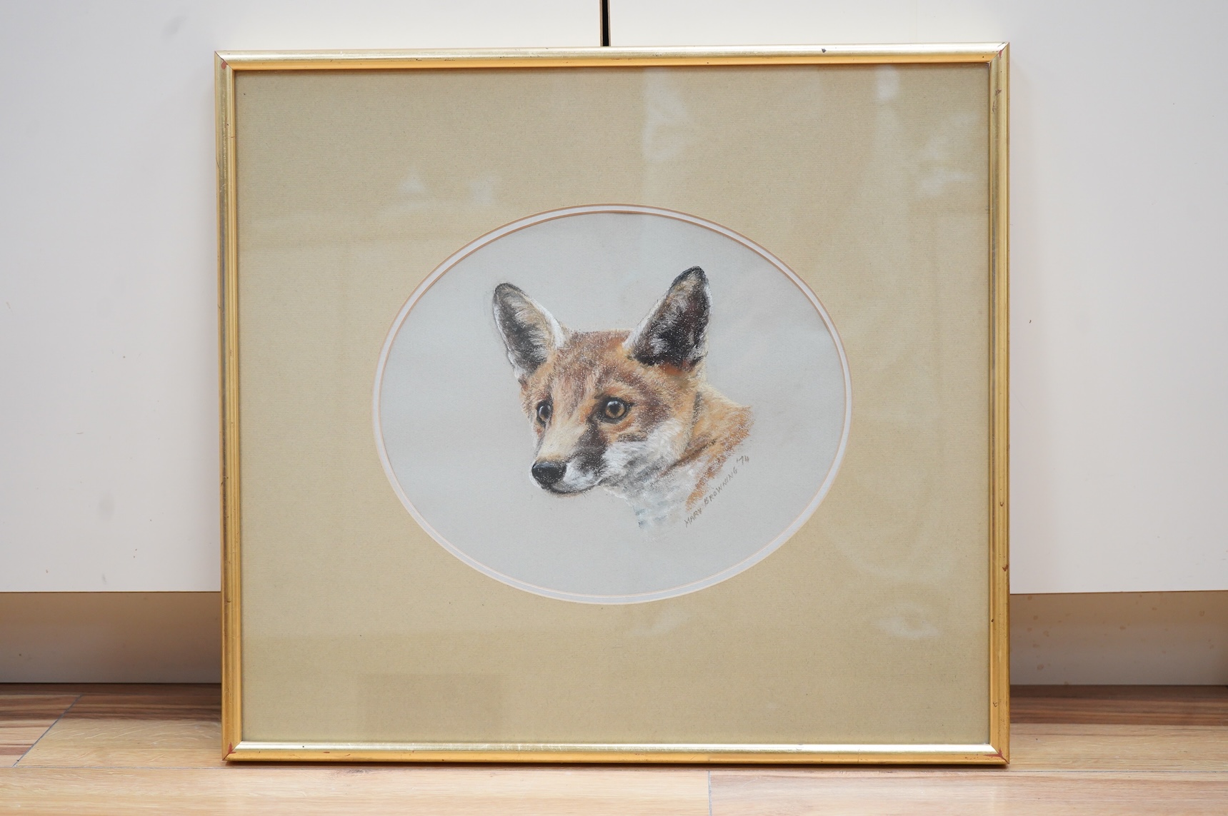 Mary Browning (20th. C), Study of a fox's head, signed and dated '74, oval pastel, 25 x 30cm